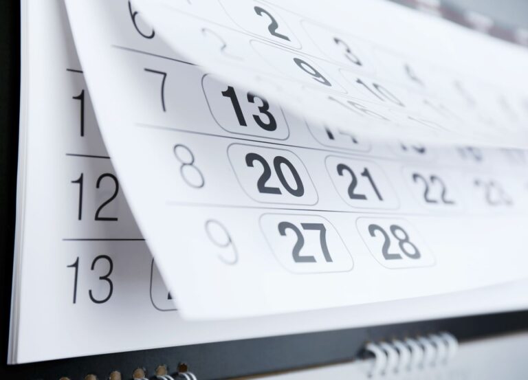 Close up on calendar pages turning.